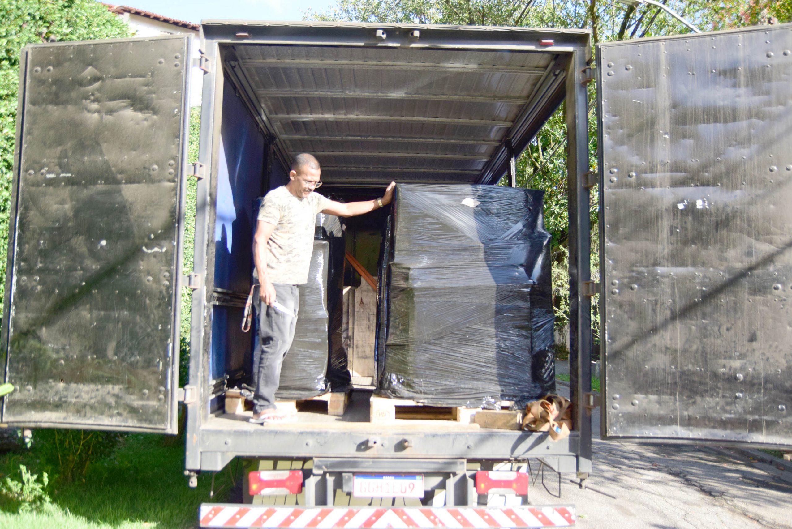 vanone driver unloading a residential removal in Rio de Janeiro, Brazil